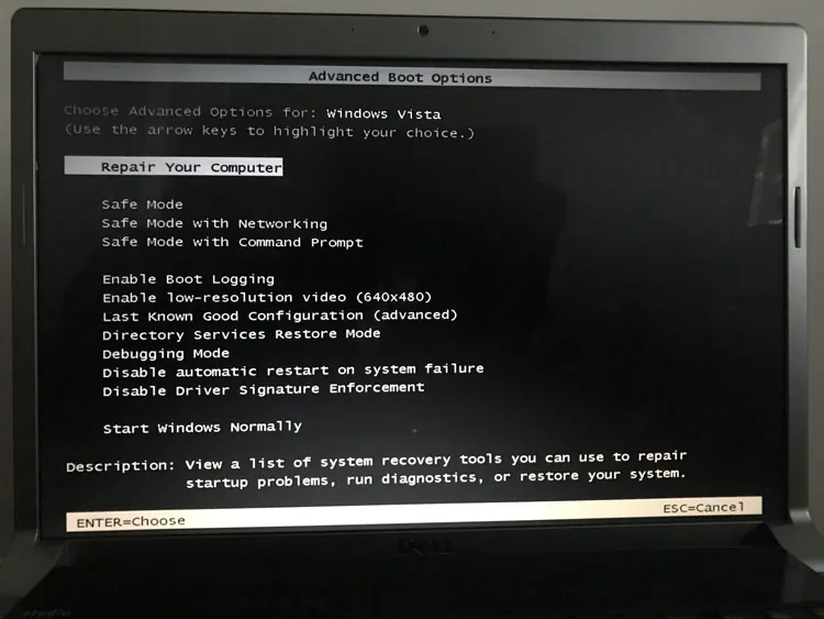 Running diagnostics on a laptop at the workshop bench