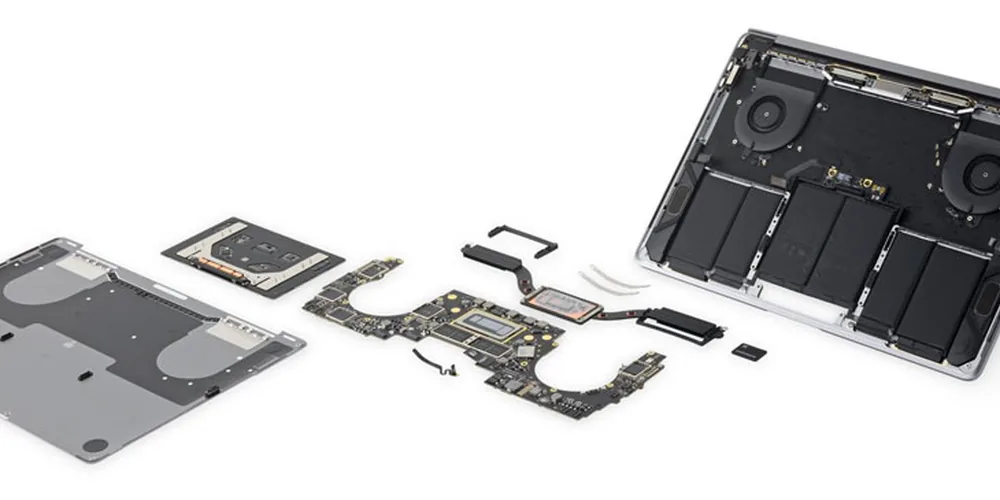 An Apple Mac laptop being repaired on the workshop bench